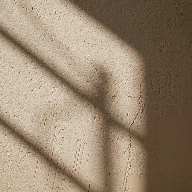 Warme Putzwand mit Lichtschatten als Hintergrundtextur für Kundenstimmen der PR-Agentur Pressegold